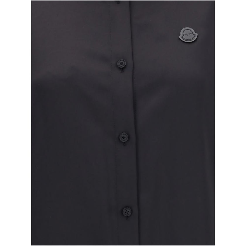 Black Polyester Dress ShirtThe Shirt in Technical Polyester Satin Moncler x EE72 collection by Edward Enninful and finished with a nylon laqué yoke lining, it features a classic shirt collar, button closure, adjustable cuffs, and a back strap with snap bu
