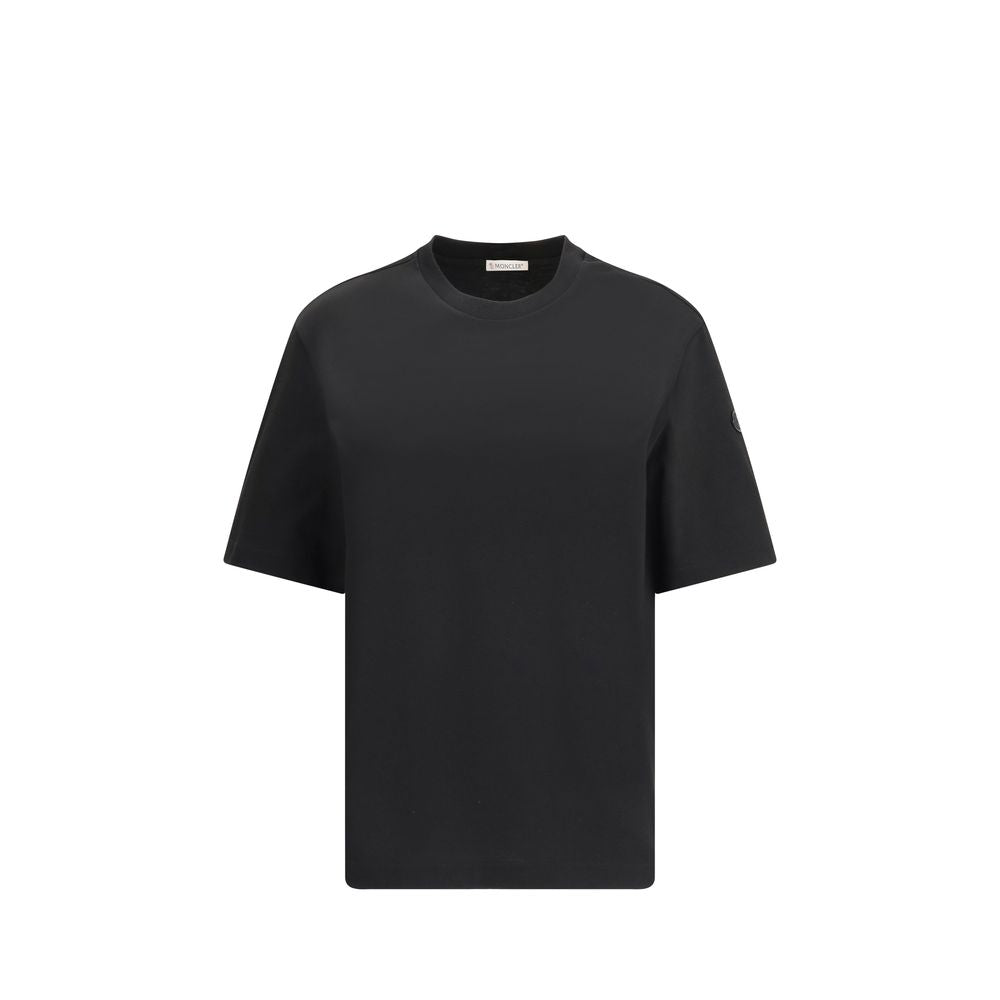 Black Cotton SportswearThe T-shirt by Moncler x EE72 by Edward Enninful is crafted from soft cotton jersey and reflects the iconic style of the collection. The ribbed crew neck and short sleeves provide an essential and versatile fit, while the unmistakab