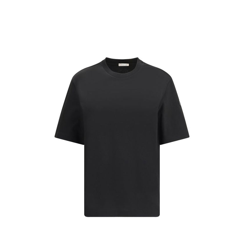 Black Cotton SportswearThe T-shirt by Moncler x EE72 by Edward Enninful is crafted from soft cotton jersey and reflects the iconic style of the collection. The ribbed crew neck and short sleeves provide an essential and versatile fit, while the unmistakab