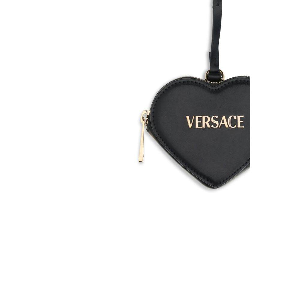Black Leather WalletThe Zip Coin Purse by Versace is crafted from soft nappa leather and embellished with a metal Versace logo. It features the Versace logo lettering and a practical zip closure. Season: AW25 Dimension: 10x10x2.5 Composition: 100% Leather