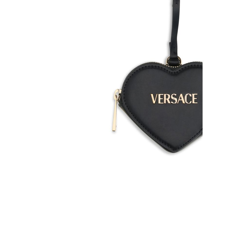 Black Leather WalletThe Zip Coin Purse by Versace is crafted from soft nappa leather and embellished with a metal Versace logo. It features the Versace logo lettering and a practical zip closure. Season: AW25 Dimension: 10x10x2.5 Composition: 100% Leather