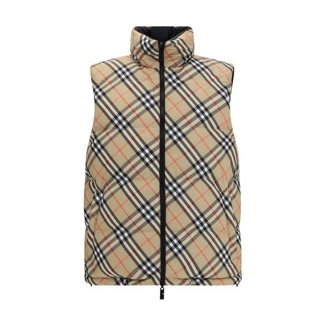 Black Polyester Sleveless JacketThe Reversible Puffer Gilet by Burberry is a versatile piece that combines functionality with iconic style. Padded with goose down and feathers, it ensures warmth and lightness. The reversible design shifts from the signatu