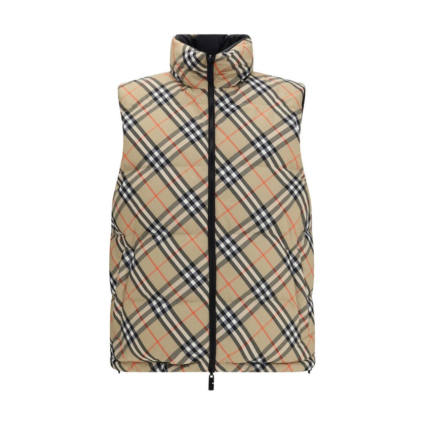 Black Polyester Sleveless JacketThe Reversible Puffer Gilet by Burberry is a versatile piece that combines functionality with iconic style. Padded with goose down and feathers, it ensures warmth and lightness. The reversible design shifts from the signatu