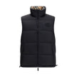 Black Polyester Sleveless JacketThe Reversible Puffer Gilet by Burberry is a versatile piece that combines functionality with iconic style. Padded with goose down and feathers, it ensures warmth and lightness. The reversible design shifts from the signatu