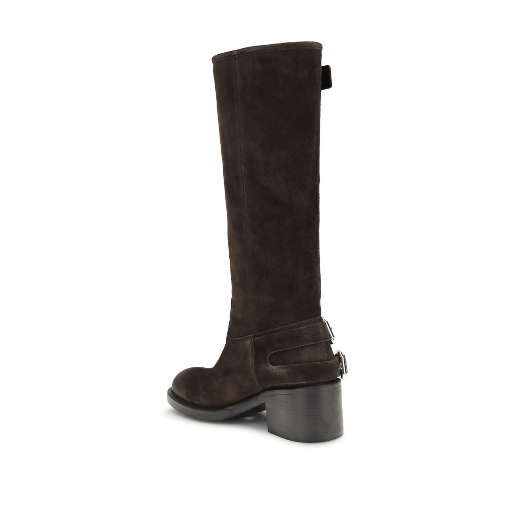 Brown Calf Leather Bos Taurus Lace-Up BootsThe Dakota Boots by Chloé are crafted from suede leather and inspired by the classic biker style. The sturdy rubber sole combines a tubular shaft with a comfortable stacked heel, while multiple silver-toned Paddi