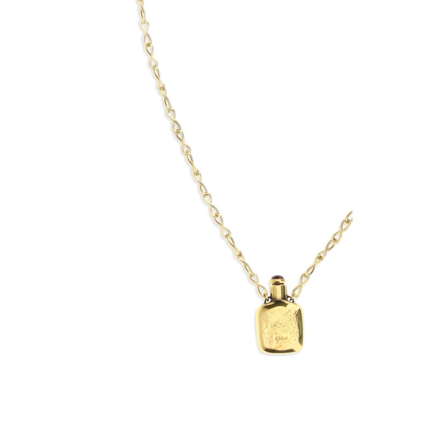 Gold Brass NecklaceThe Elixir pendant Necklace by Chloé is a jewelry piece with a vintage charm, crafted in Vintage Gold brass. The design is enhanced by a square ornamental vial topped with a resin stone. The pendant features an engraved Chloé logo, whil