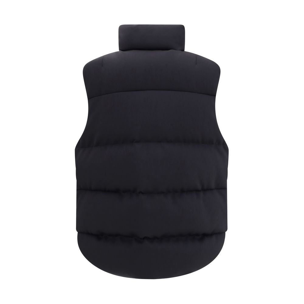 Black Polyamide Sleveless JacketThe Otis Padded Gilet from Moncler x EE72 by Edward Enninful blends style with functionality. Made from stretch cotton-blend technical jersey and nylon with a nylon laqué lining, it offers a lightweight yet durable structur