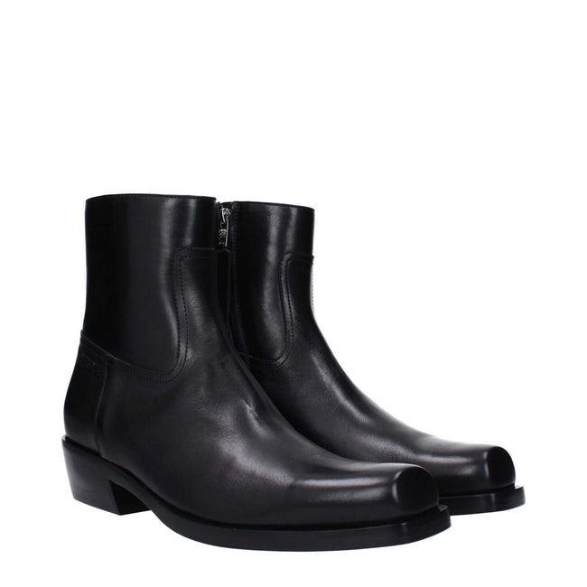 Black Leather Ankle BootsDescription: The product with MPN 10161571A110841B00E and code F82950 leather in black is a ankle boots designed by Versace. It has features like side logo. Additional Info: Style: Casual Closing type: Zip Closure Shoe sole: Leath