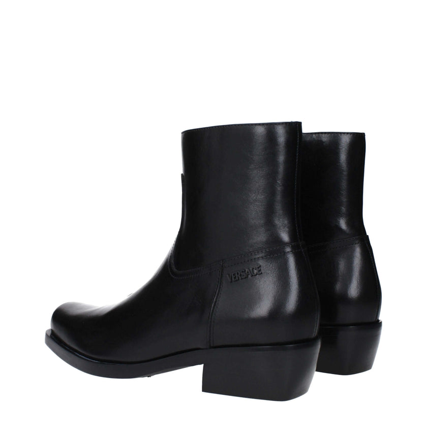 Black Leather Ankle BootsDescription: The product with MPN 10161571A110841B00E and code F82950 leather in black is a ankle boots designed by Versace. It has features like side logo. Additional Info: Style: Casual Closing type: Zip Closure Shoe sole: Leath
