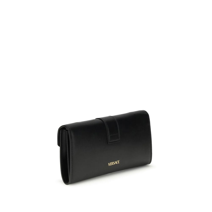 Black Calf Leather Bos Taurus WalletThe chain Wallet by Versace combines functionality and style in a compact and sophisticated design. Crafted from grained calfskin, it features a magnetic closure with a leather-covered V initial and antiqued brass-finis