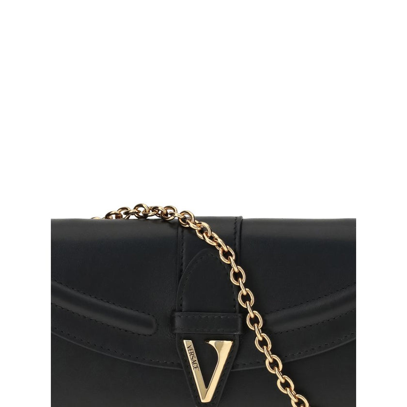 Black Calf Leather Bos Taurus WalletThe chain Wallet by Versace combines functionality and style in a compact and sophisticated design. Crafted from grained calfskin, it features a magnetic closure with a leather-covered V initial and antiqued brass-finis