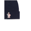 Blue Fleece Wool BeanieBeanie Hat by Moncler Grenoble is made of extra fine wool yarn, offering warmth and comfort ideal for the winter season. Featuring a 7-fine rib knit, it has an essential design enhanced by the logo patch applied on the front for a d