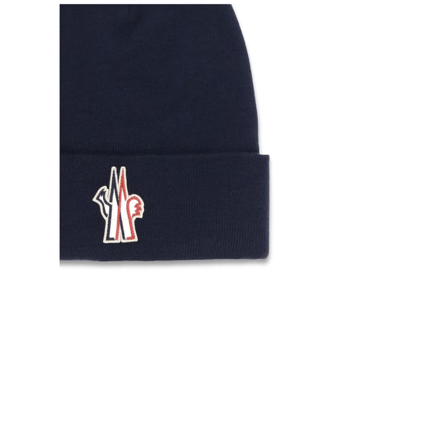 Blue Fleece Wool BeanieBeanie Hat by Moncler Grenoble is made of extra fine wool yarn, offering warmth and comfort ideal for the winter season. Featuring a 7-fine rib knit, it has an essential design enhanced by the logo patch applied on the front for a d