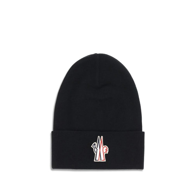 Black Fleece Wool BeanieBeanie Hat by Moncler Grenoble is made of extra fine wool yarn, offering warmth and comfort ideal for the winter season. Featuring a 7-fine rib knit, it has an essential design enhanced by the logo patch applied on the front for a
