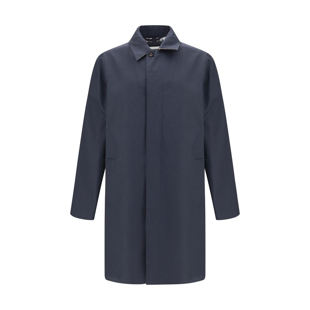 Blue Cotton CoatThe Camden Heritage Coat by Burberry is the original car coat, crafted in England from shower-resistant cotton gabardine. Part of the Heritage Collection, it features a mid-length cut with a regular fit and raglan sleeves. The single-breas