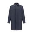 Blue Cotton CoatThe Camden Heritage Coat by Burberry is the original car coat, crafted in England from shower-resistant cotton gabardine. Part of the Heritage Collection, it features a mid-length cut with a regular fit and raglan sleeves. The single-breas