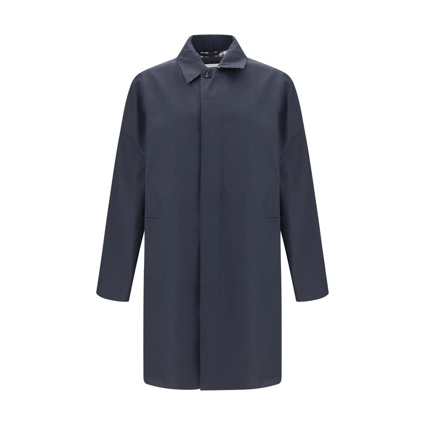 Blue Cotton CoatThe Camden Heritage Coat by Burberry is the original car coat, crafted in England from shower-resistant cotton gabardine. Part of the Heritage Collection, it features a mid-length cut with a regular fit and raglan sleeves. The single-breas