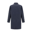 Blue Cotton CoatThe Camden Heritage Coat by Burberry is the original car coat, crafted in England from shower-resistant cotton gabardine. Part of the Heritage Collection, it features a mid-length cut with a regular fit and raglan sleeves. The single-breas