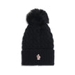 Black Fleece Wool BeanieBeanie Hat by Moncler Grenoble is made of extra fine wool yarn, ideal for ensuring warmth and comfort during the cold season. Distinguished by a refined braided knit with fineness 3, it is embellished with a matching pom-pom and co