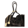 Brown Fur Shoulder BagSpin small Tote Bag by Chloè in soft shearling is distinguished by a compact, minimalist silhouette defined by clean graphic lines. The discreet elegance of the design is enhanced by a dangling chain with the iconic Chloé medals and