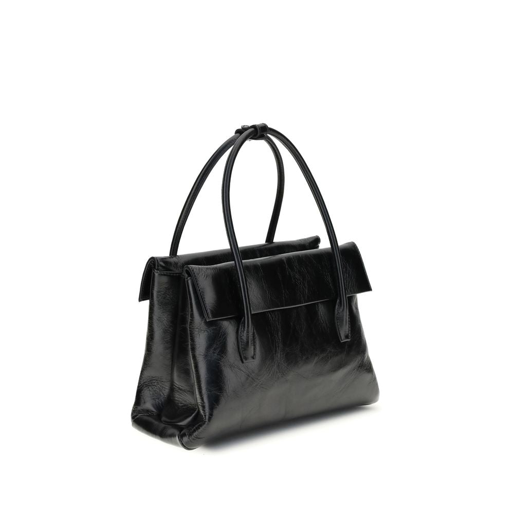 Black Calf Leather Bos Taurus HandbagSolitaire Handbag by Miu Miu combines structured lines and refined details, inspired by the maison’s 2006 archives. Made of shiny calfskin, it blends classic elegance and contemporary spirit, enhanced by the front leat