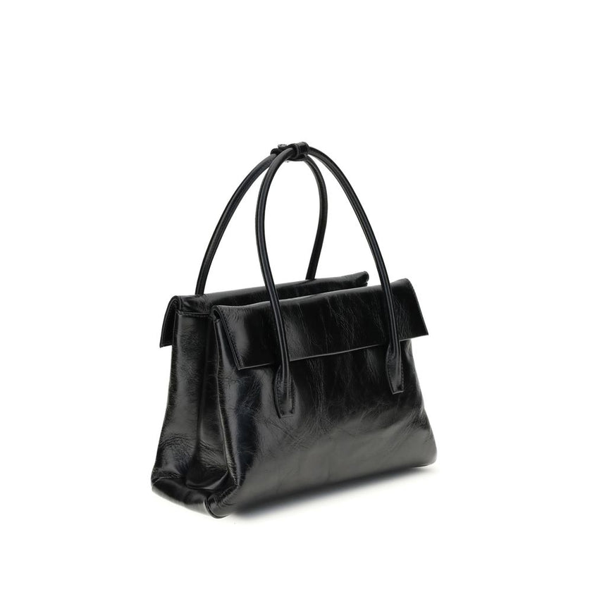 Black Calf Leather Bos Taurus HandbagSolitaire Handbag by Miu Miu combines structured lines and refined details, inspired by the maison’s 2006 archives. Made of shiny calfskin, it blends classic elegance and contemporary spirit, enhanced by the front leat