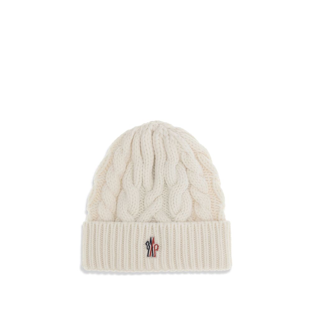 White Fleece Wool BeanieBeanie Hat by Moncler Grenoble is made of extra fine wool yarn, perfect for providing warmth and comfort during the cold season. Characterized by a refined braided knit with fineness 3, it is completed by the iconic logo patch, a d