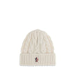White Fleece Wool BeanieBeanie Hat by Moncler Grenoble is made of extra fine wool yarn, perfect for providing warmth and comfort during the cold season. Characterized by a refined braided knit with fineness 3, it is completed by the iconic logo patch, a d