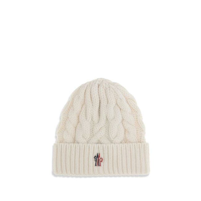 White Fleece Wool BeanieBeanie Hat by Moncler Grenoble is made of extra fine wool yarn, perfect for providing warmth and comfort during the cold season. Characterized by a refined braided knit with fineness 3, it is completed by the iconic logo patch, a d