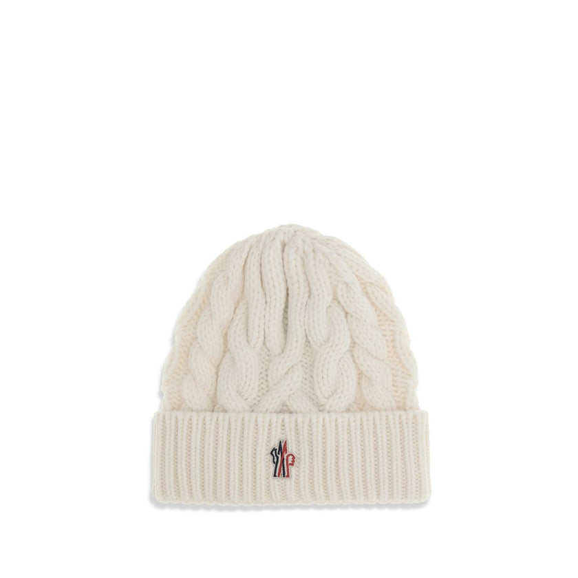 White Fleece Wool BeanieBeanie Hat by Moncler Grenoble is made of extra fine wool yarn, perfect for providing warmth and comfort during the cold season. Characterized by a refined braided knit with fineness 3, it is completed by the iconic logo patch, a d