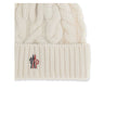 White Fleece Wool BeanieBeanie Hat by Moncler Grenoble is made of extra fine wool yarn, perfect for providing warmth and comfort during the cold season. Characterized by a refined braided knit with fineness 3, it is completed by the iconic logo patch, a d