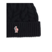 Black Fleece Wool BeanieBeanie Hat by Moncler Grenoble is made of extra fine wool yarn, perfect for providing warmth and comfort during the cold season. Characterized by a refined braided knit with fineness 3, it is completed by the iconic logo patch, a d