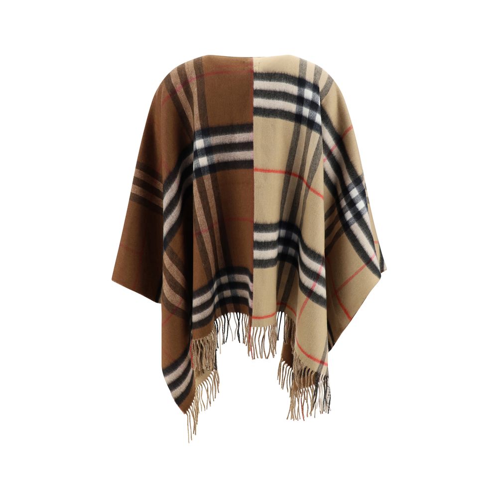 Brown Cashmere CoatMerino Wool Cape by Burberry, the brand’s iconic Archival Check pattern, frayed hems, contrasting printed brand monogram on front, shawl lapels on front. Season: AW25 Composition: 49% Kashmir/capra Hircus 51% Merino Wool MADE IN GREAT B