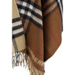 Brown Cashmere CoatMerino Wool Cape by Burberry, the brand’s iconic Archival Check pattern, frayed hems, contrasting printed brand monogram on front, shawl lapels on front. Season: AW25 Composition: 49% Kashmir/capra Hircus 51% Merino Wool MADE IN GREAT B