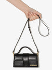 Black Le Bambino HandbagJACQUEMUS Gorgeous brand new, 100% Authentic Jacquemus Le Bambino Black Bag. Model: 213BA006-3000 Color: Black with Gold Hardware Material: Leather Bag with adjustable shoulder strap – Small handle – Removable shoulder strap – Card