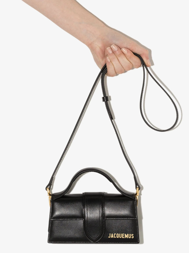Black Le Bambino HandbagJACQUEMUS Gorgeous brand new, 100% Authentic Jacquemus Le Bambino Black Bag. Model: 213BA006-3000 Color: Black with Gold Hardware Material: Leather Bag with adjustable shoulder strap – Small handle – Removable shoulder strap – Card