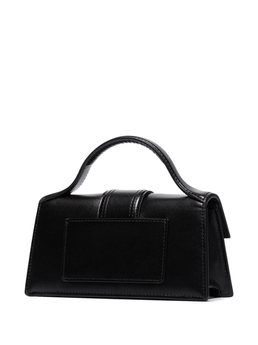 Black Le Bambino HandbagJACQUEMUS Gorgeous brand new, 100% Authentic Jacquemus Le Bambino Black Bag. Model: 213BA006-3000 Color: Black with Gold Hardware Material: Leather Bag with adjustable shoulder strap – Small handle – Removable shoulder strap – Card