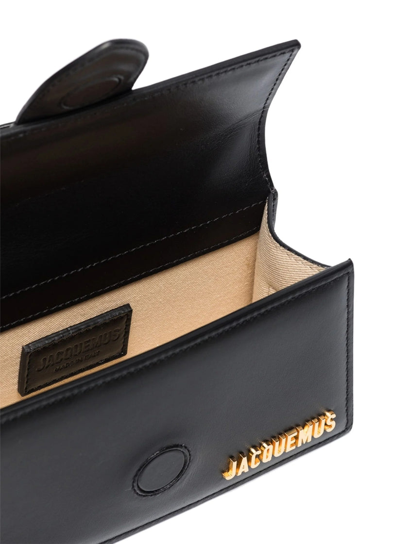 Black Le Bambino HandbagJACQUEMUS Gorgeous brand new, 100% Authentic Jacquemus Le Bambino Black Bag. Model: 213BA006-3000 Color: Black with Gold Hardware Material: Leather Bag with adjustable shoulder strap – Small handle – Removable shoulder strap – Card