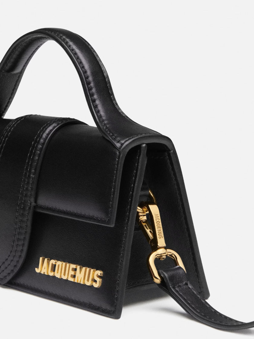 Black Le Bambino HandbagJACQUEMUS Gorgeous brand new, 100% Authentic Jacquemus Le Bambino Black Bag. Model: 213BA006-3000 Color: Black with Gold Hardware Material: Leather Bag with adjustable shoulder strap – Small handle – Removable shoulder strap – Card