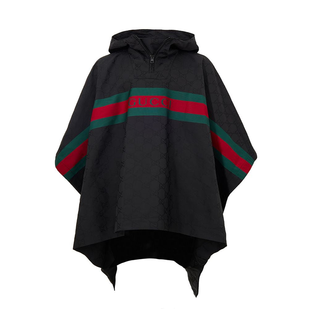 Black Polyester Trench CoatBlack Cape with Web Logo and Gucci GG Monogram Print. In black technical fabric, allover logo, maxi contrasting Gucci Web Logo on the front, adjustable hood and half zip on the front. Buttons on the sides to adjust the fit, adju
