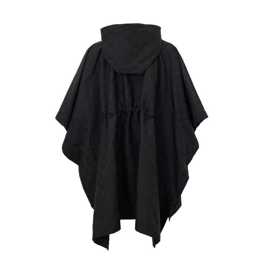 Black Polyester Trench CoatBlack Cape with Web Logo and Gucci GG Monogram Print. In black technical fabric, allover logo, maxi contrasting Gucci Web Logo on the front, adjustable hood and half zip on the front. Buttons on the sides to adjust the fit, adju