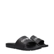Black Cotton SlippersDescription: The product with MPN OMIU002MAT0011001 and code F84958 rubber in black is a slippers and clogs designed by Off-White. It has features like front logo.Black Cotton Slippers${tagsOff-WhiteAulae Black Cotton Slippers Off-Whi