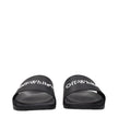 Black Cotton SlippersDescription: The product with MPN OMIU002MAT0011001 and code F84958 rubber in black is a slippers and clogs designed by Off-White. It has features like front logo.Black Cotton Slippers${tagsOff-WhiteAulae Black Cotton Slippers Off-Whi