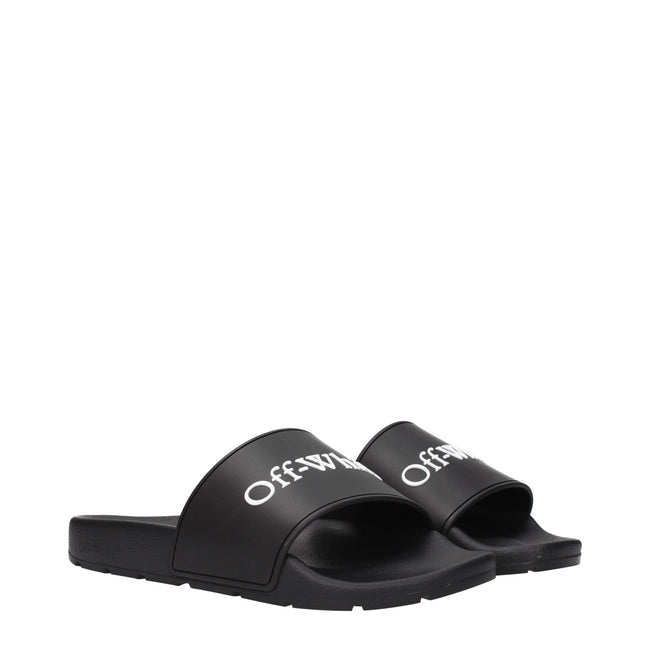 Black Cotton SlippersDescription: The product with MPN OWIU001MAT0011001 and code F84957 rubber in black is a slippers and clogs designed by Off-White. It has features like front logo.Black Cotton Slippers${tagsOff-WhiteAulae Black Cotton Slippers Off-Whi