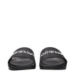 Black Cotton SlippersDescription: The product with MPN OWIU001MAT0011001 and code F84957 rubber in black is a slippers and clogs designed by Off-White. It has features like front logo.Black Cotton Slippers${tagsOff-WhiteAulae Black Cotton Slippers Off-Whi