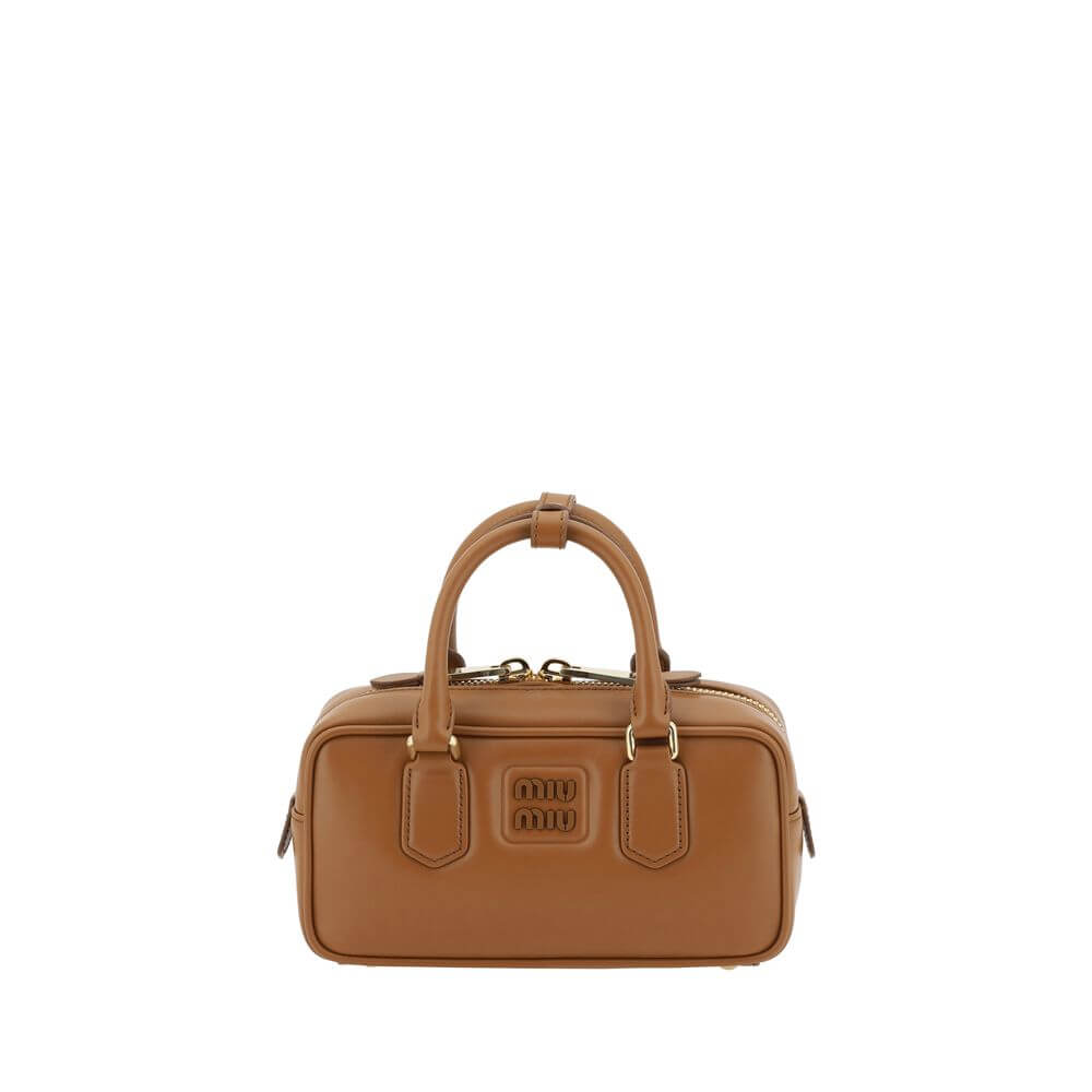 Arcadie HandbagLeather Arcadie Handbag by Miu Miu, double rigid and tubular handles at top, top zipper closure, iconic brand monogram press-stamped on front, single interior compartment, removable and adjustable flat leather shoulder strap. Season: AW25 D