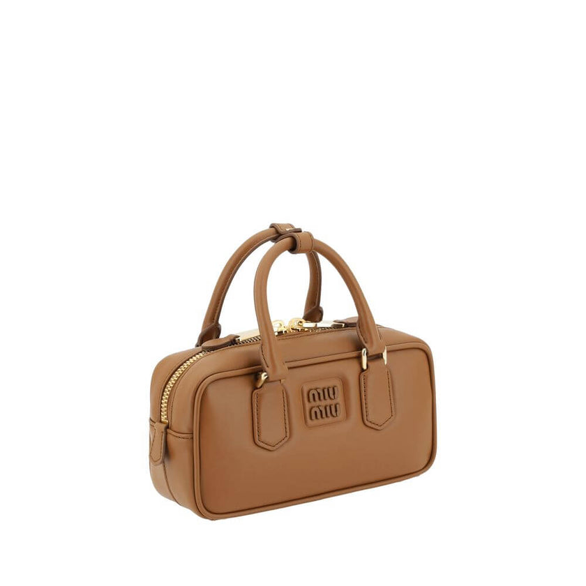 Arcadie HandbagLeather Arcadie Handbag by Miu Miu, double rigid and tubular handles at top, top zipper closure, iconic brand monogram press-stamped on front, single interior compartment, removable and adjustable flat leather shoulder strap. Season: AW25 D