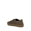 Brown Rubber Low Top SneakersDomino Sneakers by Fendi reinterpret urban style with refined details and high-quality materials. This low-top lace-up model is crafted in soft brown suede, with an elegant tone-on-tone metal FF side detail, enhanced by a ruth