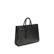 Black Calf Leather Bos Taurus HandbagThe Sac De Jour bag by Saint Laurent combines functionality and style with a soft structure, side gussets, and compression straps with tabs. It features round handles with a lock housed in a removable leather case and