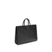 Black Calf Leather Bos Taurus HandbagThe Sac De Jour bag by Saint Laurent combines functionality and style with a soft structure, side gussets, and compression straps with tabs. It features round handles with a lock housed in a removable leather case and